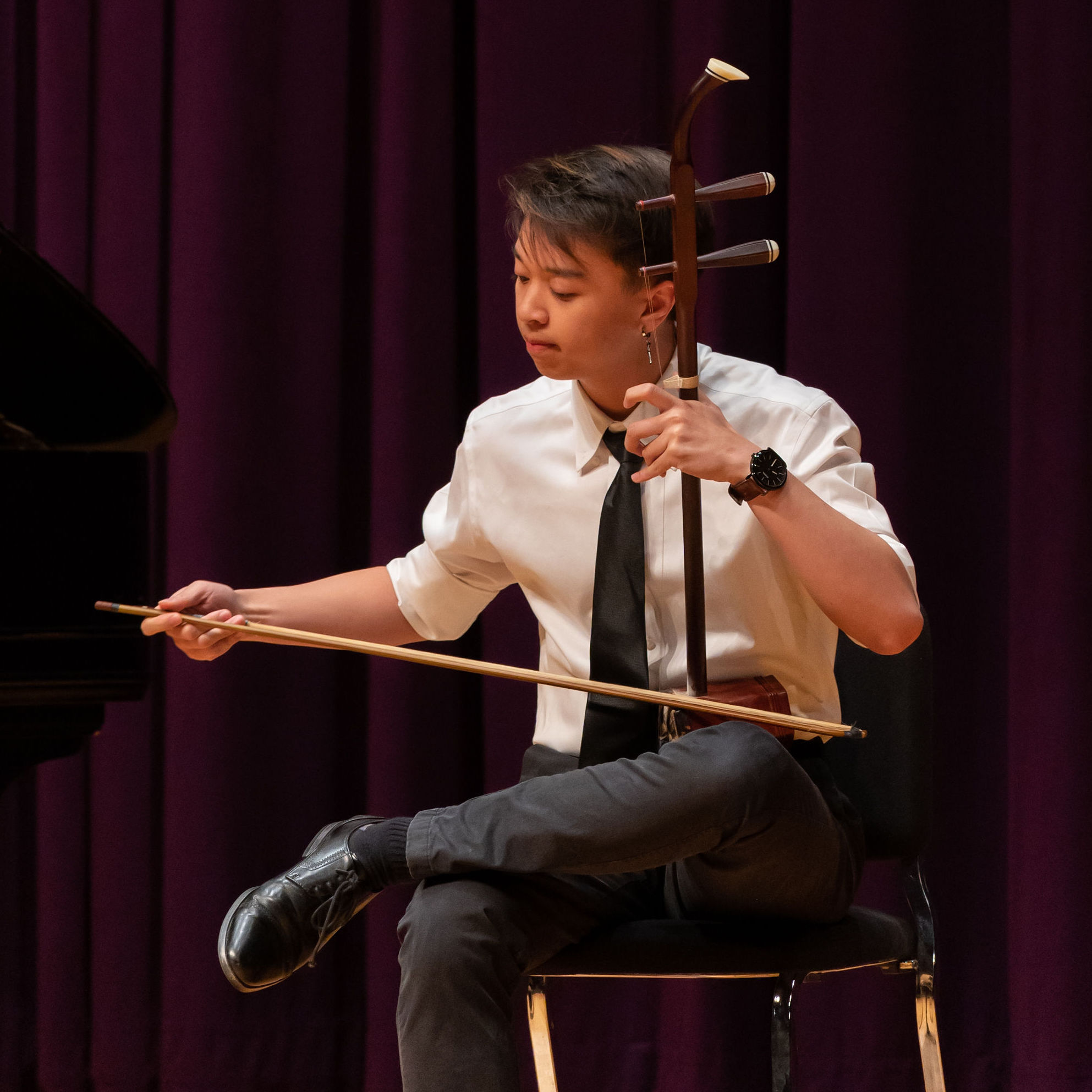 Photo of an instrumentalist playing the erhu