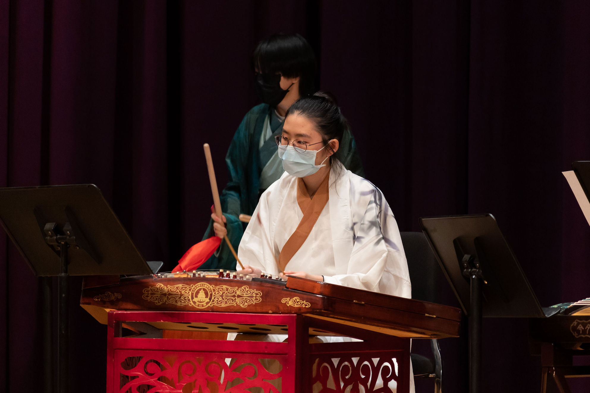 Photo of an instrumentalist playing the yanqin